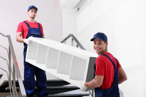 Manager assessing a complaint in a removals office