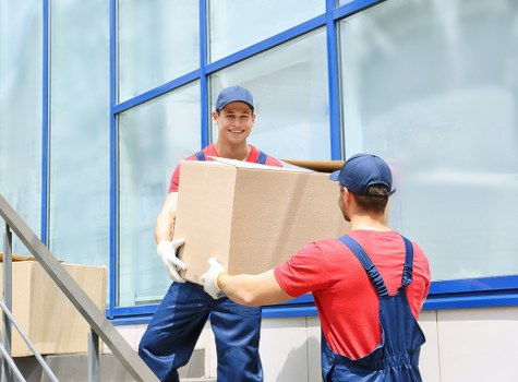 Professional movers loading household items in Putney