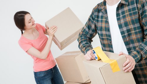 Strong moving boxes and wrap ready for a Putney packing service