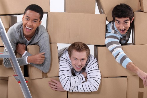 Professional Putney movers packing and loading boxes