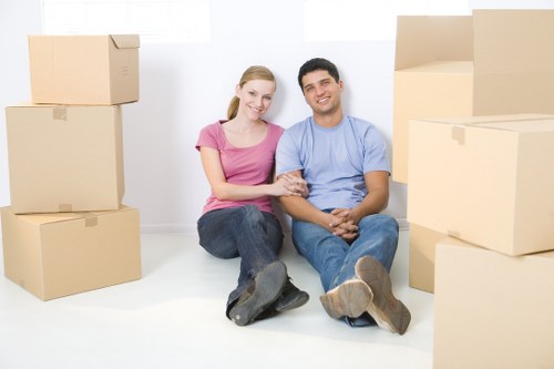 Packed office furniture ready for relocation in Putney