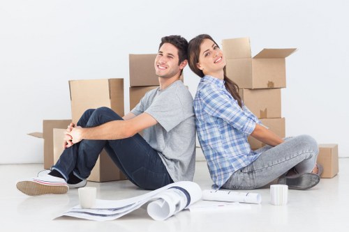 Professional movers packing household items for a Putney relocation