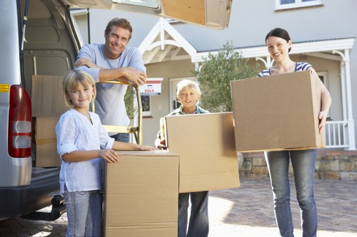 Local Putney removal team handling bulky household furniture