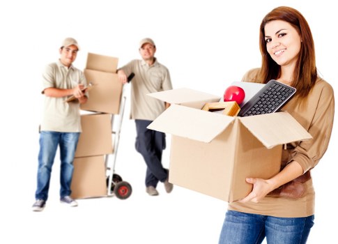 Packed boxes and furniture loaded into a Putney removal van