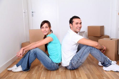 Packed moving boxes and protective wrapping prepared for a Putney home removal