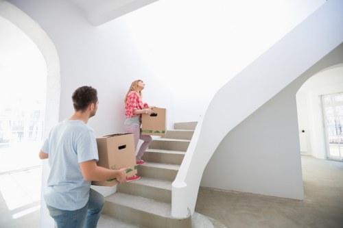 Apartment moving planning in Putney with boxes and furniture ready