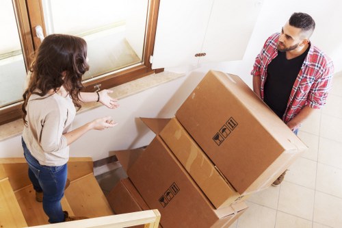 Selection of sturdy cardboard boxes and tape for packing in Putney