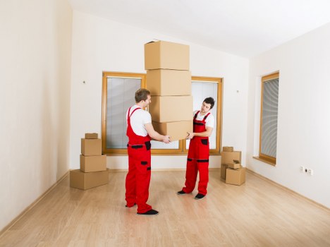 Loading furniture into a removal truck in a Putney street